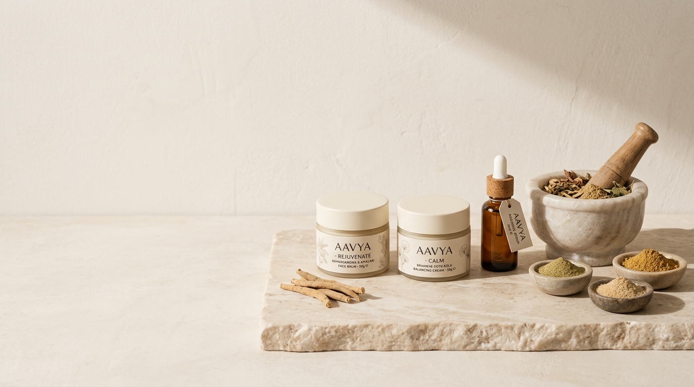 AAVYA Ayurvedic formulations — ashwagandha root, herbal powders, marble mortar and amber dropper bottle on warm stone